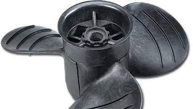 Close-up of a black, three-blade propeller with ridged edges on a white background.