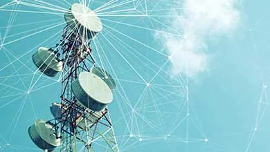 Telecommunications tower with multiple antenna dishes overlaid with a digital network graphic against a blue sky.
